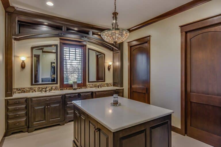 View of bathroom vanity in South Bend Indiana with bathroom island and mirrors