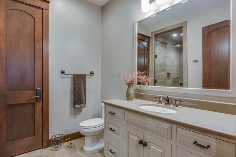 White bath cabinets in South Bend Indiana with black handles