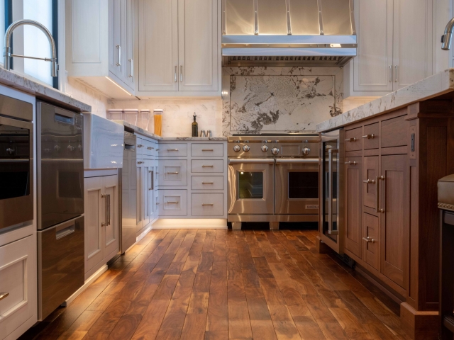 Grey inset kitchen cabinets with oven and island