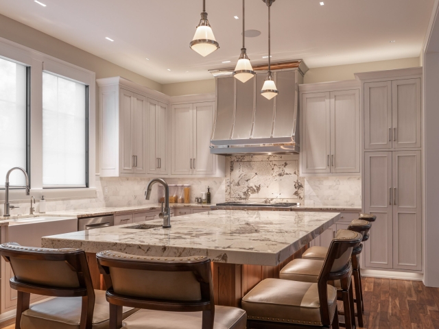 Grey inset kitchen cabinets with marble countertop