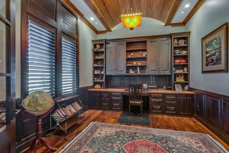 View of office space, custom cabinets and desk