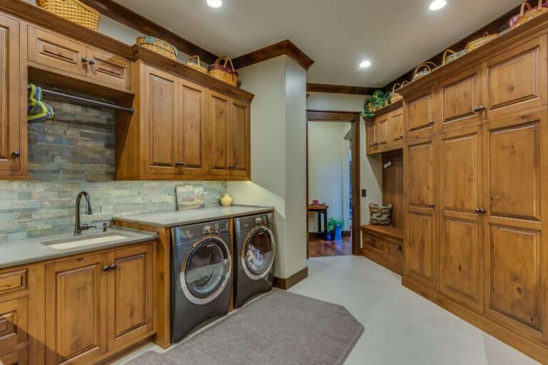 View of laundry room with custom cabinets and counter area in South Bend Indiana