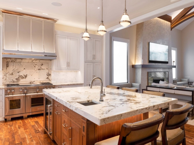 Grey inset kitchen cabinets with marble countertop