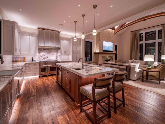 Wide shot of kitchen with table and inset cabinets