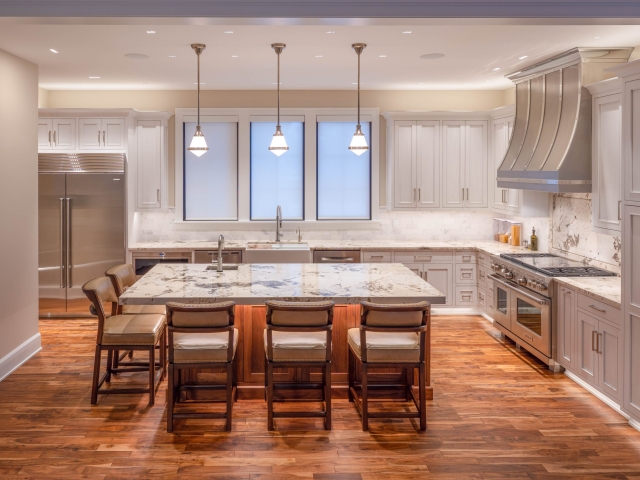 Side view wide shot of kitchen with grey inset kitchen cabinets