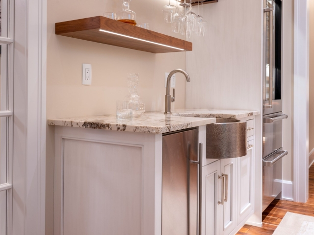 Inset kitchen wet bar with wine glasses