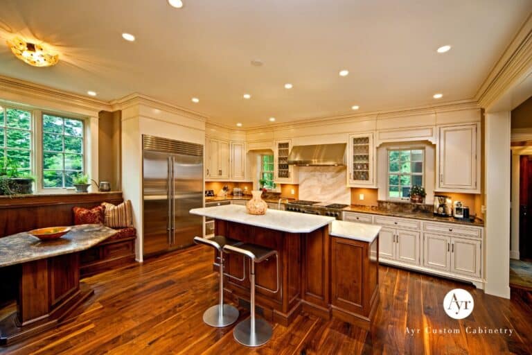 Kitchen &amp; Bar Cabinets in South Bend Indiana with white cabinets, custom wooden island and matching table and bench