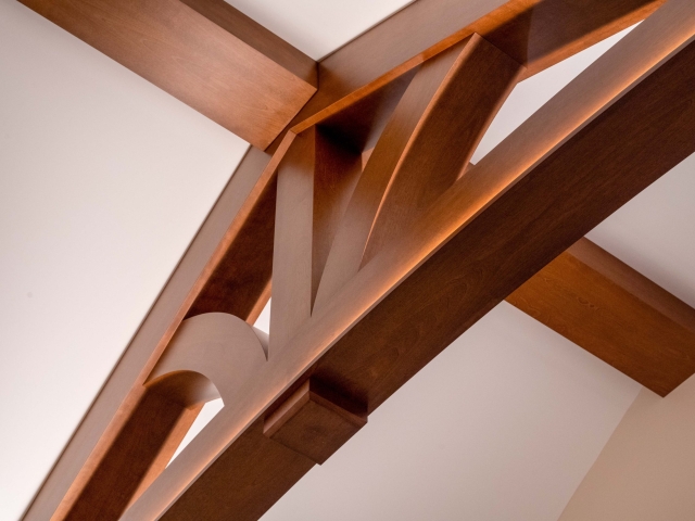 Wooden trusses on a vaulted ceiling