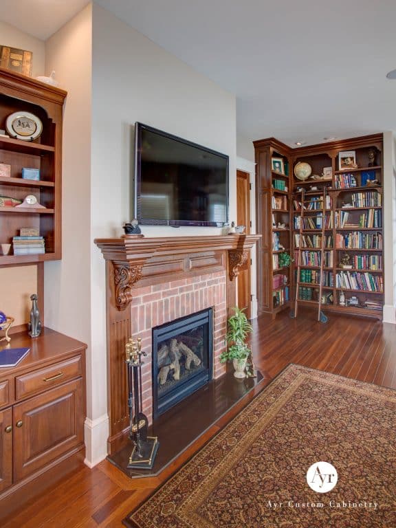 custom library shelves and fireplace in diamond lake mi