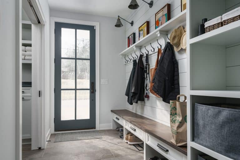 laundry room with white cabinets in long beach