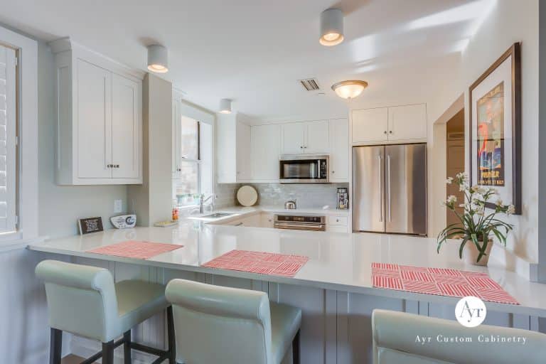 custom kitchen cabinets with bar seating in st joseph