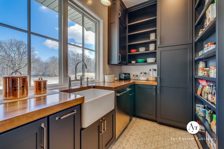 custom butler kitchen, pantry cabinets with a sink