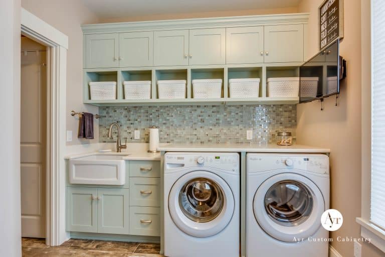 custom green laundry room cabinets